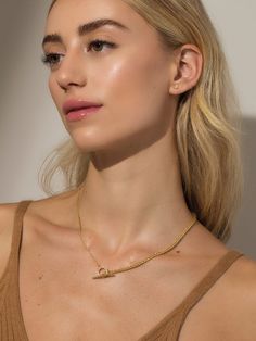 A dainty chain and a thick chain meet in the middle with a pavé circle closure and a large toggle bar to create our Turn It up Chain Necklace. This gold chain necklace is the perfect everyday style that can be layered with simple or bold necklaces — it’s all up to you. | Turn It Up Chain Necklace GOLD Elegant Toggle Link Necklace For Everyday, Elegant Lariat Chain Necklace With Toggle Clasp, Minimalist Toggle Necklace With Chunky Chain For Everyday, Elegant Everyday Toggle Link Necklace, Timeless Everyday Clavicle Chain Necklace, Everyday Chain Link Toggle Necklace, Everyday Toggle Necklace With Chain, Everyday Toggle Clasp Chain Link Necklace, Minimalist Everyday Toggle Necklace With Chunky Chain