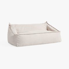 a white dog bed on a white background