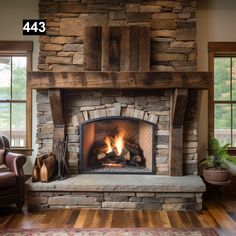 a stone fireplace in a living room with wooden floors