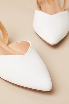 Step into style with the Lulus Mae White and Beige Pointed-Toe Slingback Flats! These vegan leather cuties are the perfect blend of chic and sensible with their low-maintenance flat sole, comfortable beige elastic slingback, and cute notched pointed-toe upper. 0. 25" rubber heel. Cushioned insole. Rubber sole has nonskid markings. All Man Made Materials. Imported. Lulus | Mae White and Beige Pointed-Toe Slingback Flats | Vegan Friendly. Elegant Synthetic Slingback Sandals With Flat Heel, Trendy White Slingback Pumps For Spring, Elegant Faux Leather Slingback Pumps, Formal Faux Leather Slingback Pumps, Elegant Summer Slingback Pumps In Faux Leather, Elegant Summer Faux Leather Slingback Pumps, Elegant Faux Leather Slingback Pumps For Summer, Chic Synthetic Low Heel Slingback Pumps, Chic Synthetic Slingback Pumps With Low Heel