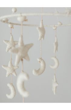 a white mobile with stars and crescents hanging from it