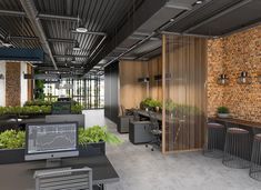 an office with brick walls and lots of plants