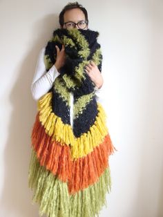 ">> Match the hat to this scarf: https://www.etsy.com/shop/WoolFans?ref=seller-platform-mcnav&section_id=14152943 >> This knit scarf with stripes, asymmetrical edges, and three layers of fringe is not only a functional accessory for keeping you warm in chilly weather but also a bold statement piece that speaks to your impeccable sense of style. Whether you wear it draped loosely over your shoulders or wrap it snugly around your neck, it's a fashion-forward choice for those who appreciate both wa Scarf With Tassels, Scarf Chunky, Mohair Scarf, Chunky Knit Scarves, Striped Scarf, Chunky Scarves, Large Scarf, Striped Scarves, Fringe Scarf