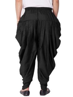 Vastramay brings to you this Stylish yet Comfortable Men Black Men Cotton Art Silk Cowl Design Patiala Style Dhoti Pant. Adorn it for a perfect Classy and Trendy look. Pair it with a juti or a mojari for the Royal look. Product Features : Top Color: Black Bottom Color: Black Top Fabric: Cotton Art Silk Bottom Fabric: Cotton Art Silk Blend Product Type: Cowl Design Patiala Style Dhoti Pant Fabric Purity: Blended Weave Pattern: Regular Disclaimer: There will be slight difference in digital to actu Cotton Festival Bottoms, Fitted Cotton Bottoms For Festivals, Ankle-length Cotton Bottoms For Eid, Traditional Cotton Harem Pants For Navratri, Traditional Festive Cotton Harem Pants, Traditional Black Harem Pants For Yoga, Traditional Cotton Pants With Drape, Traditional Fitted Bottoms For Navratri, Traditional Full-length Pants For Festivals