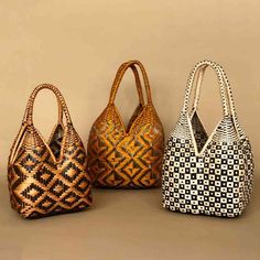 three woven bags sitting next to each other