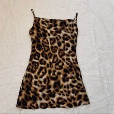 Mini Cheetah Print Dress Size M Brand New Satine Material Trendy Fitted Leopard Print Mini Dress, Fitted Tiger Print Mini Dress For Spring, Fitted Sleeveless Mini Dress With Tiger Print, Fitted Sleeveless Tiger Print Mini Dress, Chic Tiger Print Mini Dress, Chic Mini Dress With Tiger Print, Fitted Tiger Print Mini Dress For Summer, Casual Leopard Print Mini Dress For Date Night, Summer Mini Dress With Tiger Print