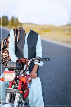 a man sitting on the back of a motorcycle