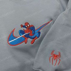 Introducing the Spider-Man Nike Swoosh Shirt, the perfect blend of superhero style and athletic performance. Made with premium materials, this shirt showcases the iconic Spider-Man logo beautifully embroidered on the chest, giving you a unique and fashionable look. The moisture-wicking fabric ensures you stay cool and dry during intense workouts or casual outings. With its comfortable fit and eye-catching design, this shirt is sure to turn heads wherever you go. Join forces with Spider-Man and u Sporty Custom Embroidered Tops For Streetwear, Custom Embroidered Tops For Streetwear, Sporty Embroidered Top For Streetwear, Spiderman Nike, Nike Inspired, Marvel Sweatshirt, Nike Clothes, Embroidered Apparel, Superhero Fashion