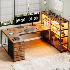 a computer desk with two monitors and a keyboard on it in front of a window