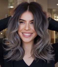 This cool-toned look blends ash brunette with dark roots, creating a fresh and modern winter hairstyle. The soft waves enhance the gradient effect, transitioning from dark at the roots to a silvery-ash tone at the tips. It’s perfect for brunettes wanting to experiment with cooler palette ideas for winter. Cool Toned Brunette Hair With Ash Balayage, Mushroom Brown With Dark Roots, Fall Ashy Brown Hair, Ash Brown Glaze Hair, Ash Gray Brown Hair Color, Brown And Ash Hair, Ash Brown Hair With Dark Roots, Iced Latte Hair Color, Ash Brown Hair Dark Roots