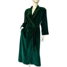 This beautiful green velvet robe from I. Magnin is the perfect addition to your winter wardrobe. The luxurious velour fabric and gold trim accent add a touch of elegance to this classic piece. Featuring a V-neckline, long sleeves with shoulder pads, and a tie closure, this vintage robe is both stylish and comfortable. Machine washable and made with a cotton blend, it is easy to care for and perfect for any occasion. Whether you're looking for a cozy robe to wear during the holidays or just lounging around the house, this I. Magnin robe is sure to become a favorite. This Robe is in very good condition! Shoulder to shoulder laying flat across 19" Pit to pit approximately 21" across Length from shoulder to hem 50" Sleeves length approximately 23" Cotton polyester blend Closet Addition, Velour Fabric, 60s Dress, Womens Robes, Long Tunic, Sweaters Crewneck, Green Velvet, Holiday Christmas, Winter Wardrobe