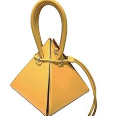 Fashionable And Portable Handbag Perfect For Holding Small Cosmetics, Cell Phones, Keys, Cards, Cash And Etc. Has Unique Design Pyramid Shape Yellow Color More Mustard Color Handbag Made With High-Quality Soft Pu Leather. Also Has Shoulder Strap And Double Handles With Drawstring Closure. 8 X 6 X 8 Inches. Yellow Box Bag With Detachable Handle, Elegant Large Capacity Yellow Bag, Elegant Yellow Top Handle Bucket Bag, Elegant Yellow Bucket Bag With Top Handle, Chic Yellow Square Satchel, Chic Yellow Satchel With Phone Bag, Chic Yellow Box Bag With Removable Pouch, Chic Yellow Satchel With Mobile Phone Bag, Chic Yellow Square Bag