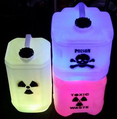 three different colored plastic containers with skull and crossbones on them