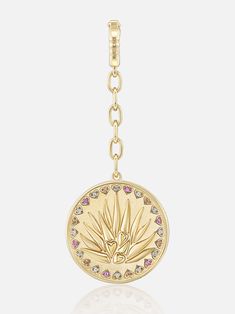 18k yellow gold agave medallion with a diamond and sapphire heart cut out border that is marked with “Sip Me”. The second in our annual holiday series of “Lauren’s Loves” — the first was caviar — this three charm set in honor of tequila is the perfect gift or self-purchase for the life of the party. Whether Lauren is enjoying her husband’s locally-famous margaritas, relaxing with a refreshing Paloma or sipping it neat, tequila is her number one choice for imbibing. In honor of her devotion to th Gold Round Jewelry With Logo Charm, Luxury Medallion Jewelry With Logo Charm, Yellow Gold Medallion Jewelry With Logo Charm, Gold Jewelry With Logo Charm For Anniversary, Heart Cut Out, Life Of The Party, Charm Set, Rock Crystal, Sparkle Diamonds