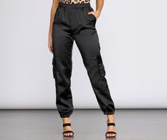 Sleek satin is your new go-to. These joggers feature a high rise elastic banded waist. slanted front pockets. cargo style side pockets. and a tapered jogger hem. The relaxed fitting pants are composed of a satin-like fabric with no stretch. Casual Cargo Pants For Night Out, Casual Night Out Cargo Pants, Casual Cargo Pants With Pockets For Night Out, Jogger Outfit, Satin Joggers, Fitting Pants, Cami Midi Dress, Maxi Dress Pattern, Ribbed Mini Dress