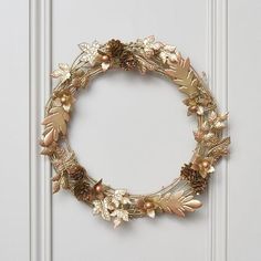 a gold wreath hanging on the front door