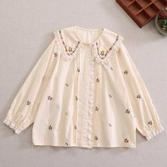 Material: Polyester Measurement cm in Shoulder 40 15.75 Bust 124 48.82 Sleeve 56 22.05 Length 67 26.38 Cute Spring Blouse With Peter Pan Collar, Cotton Long Sleeve Blouse With Floral Embroidery, Spring Blouse With Cute Collar, Embroidered Tops With Doll Collar For Spring, Embroidered Doll Collar Top For Spring, Spring Embroidered Tops With Doll Collar, Casual Doll Collar Blouse For Spring, Embroidered Collar Top For Fall, Embroidered Cotton Collar Tops