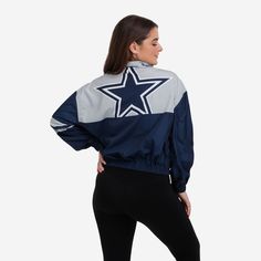 This Dallas Cowboys Women's Winning Play Windbreaker has a bold team logo on the back, so you can show off your team spirit to everyone you leave in the dust while you run the track. Features All-over team-colored design so you can rep the team in style Team logo display on upper left chest, in case there were any doubts where your allegiances lie Bold team logo display on reverse side for an additional dose of awesome Left arm stripes Half-zip structure Long sleeves, so you can fan on even if i Dallas Cowboys Windbreaker, Dallas Cowboys Christmas Ornaments, Cheerleader Jacket, Dallas Cowboys Christmas, Dallas Cowboys Women, Cheerleader Costume, Dallas Cowboys Cheerleaders, Logo Display, Leave In