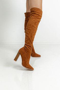 This boot runs more true to size. Heel Height: 4 Inches Boot Height: 22 Inches Calf Circumference: 13 Inches Winter Brown Knee-high Platform Boots, Brown Knee-high Boots For Fall, Winter Knee-high Brown Platform Boots, Brown Wide Calf Boots For Fall, Brown Over-the-knee Winter Boots, Brown Suede Platform Boots For Fall, Brown Knee-high Boots, Brown Thigh High Boots For Fall, Tall Brown Boots With Pointed Toe