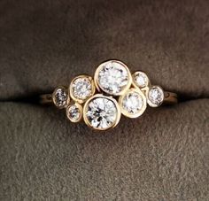 a diamond ring sitting on top of a couch