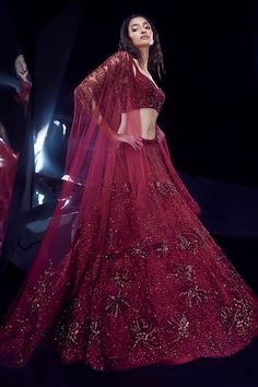 French red attached cancan lehenga with sequin, cutdana, bead, crystal embellishment in floral and geometric pattern. Paired with sleeveless embroidered padded blouse. Comes with border embroidered dupatta. - Aza Fashions Red Party Wear Dupatta With Intricate Embroidery, Glamorous Fitted Wedding Dupatta, Red Embellished Party Wear Lehenga, Party Wear Red Choli With Intricate Embroidery, Red Embellished Party Wear Choli, Embellished Red Choli For Party Wear, Glamorous Wedding Lehenga In Organza, Red Embroidered Party Wear Choli, Red Embellished Organza Sets