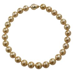 This contemporary necklace is composed of 27 natural color golden cultured South Sea Pearls measuring approximately 17.20 to 15.00mm. Completed by a baroque pearl form 14K gold clasp, the round golden pearls have a touch of rose colored orient. Unusual in their warm golden hue and large size, these lovely pearls are specially lustrous and appealing. Product Details: Item #: YN-21018 Country: United States Circa: Contemporary Dimensions: 19.00" length Materials: 14K Gold Signed: 585 Macklowe Gallery Curator's Notes: Golden cultured pearls of this size have a thick nacre, which enhances their rich luminescence and the crispness of their reflections.