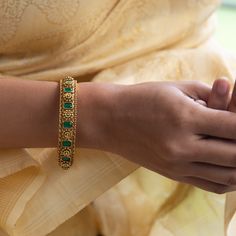 Description : This bangle from the antique jewelry collection by Tarinika presents the classic Indian design. It has a vintage-inspired design with semi-precious stones for a timeless look. It complements your festive attire and makes you ready for your special day. Details & Specifications: Materials used: Brass Alloy with Antique Plating Weight - 2.4-52gm, 2.6-55gm, 2.8-58gm Size - 2.4 - 5.5 cm, 2.6 - 6 cm, 2.8 - 6.5 cm Make it custom : Want to make it a custom bangle? Sure! Reach out to us at Antique Bangles, Custom Bangle, Festive Attire, Buy Jewellery Online, Antique Jewelry Indian, Indian Jewellery Design, Traditional Earrings, Kundan Earrings, Indian Earrings