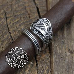 This is an adjustable wrap style ring featuring a Harp design.A fantastic Ring sculpted by yours truly, Doctor Gus! Wear this ring to make a bold statement everyday. Or get one to add that perfect final touch to your next cosplay. Each one is unique and sure to start a conversation!—————You will receive one Ring as pictured.Available in multiple sizes. Our rings are also adjustable. So you can pick your size and make that final adjustment for the perfect fit if you need to.It is unisex and looks Harp Design, Unicorn Ring, Pewter Ring, To Start A Conversation, Celtic Knot Ring, Spoon Rings, Antique Inspiration, Celtic Jewelry, Unisex Ring