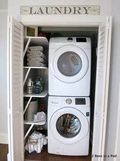 a white washer and dryer sitting inside of a small closet next to each other