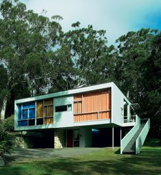 a modern house in the middle of some trees