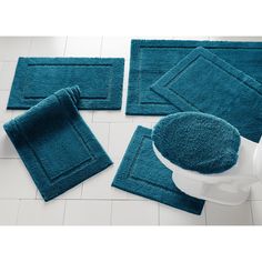 blue bathroom rugs and bath mats on the floor