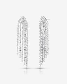 Why We Love Them: Strings of sparkling diamonds delicately hang at graduating lengths in these striking statement earrings. Evening Diamond Cut Chandelier Earrings, Diamond Cut Chandelier Earrings For Evening, Evening Diamond Chandelier Earrings With Prong Setting, Diamond Chandelier Earrings For Evening, Evening Chandelier Drop Earrings With Diamond Accents, Luxury Linear Earrings With Diamond Cut For Evening, Dazzling Chandelier Earrings With Brilliant Cut For Evening, Dazzling Long Drop Evening Jewelry, Dazzling Brilliant Cut Chandelier Earrings For Evening