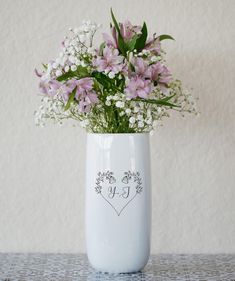 a vase filled with flowers on top of a table