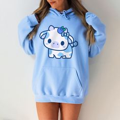 PLEASE NOTE:  This is a UNISEX hoodie.  If you want an oversized look then consider ordering up a size. You will look absolutely adorable in this kawaii blueberry cow hoodie!  Makes for a great gift to give to your friends as well. There are no side seams. A kangaroo pocket hangs in front. The hood's drawstring is the same color as the base sweater.  .: 50% cotton, 50% polyester .: Medium-heavy fabric (8.0 oz/yd² (271 g/m .: Classic fit .: Tear-away label .: Runs true to size Blueberry Cow Tattoo, Cute Back To School Outfits 6th Grade, Cute Clothes For Teenagers, Fall Fits For School, Cute Clothes For School, Softie Clothes, Cute Clothing Ideas, Cute Outfits For Winter, Cute Winter Clothes