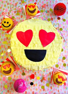 a paper plate with hearts and faces on it