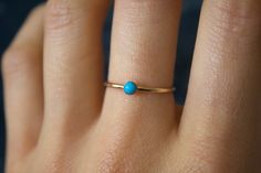 STUNNING 14k gold filled or Sterling Silver handmade natural Turquoise ring ✨ * Listing covers the single Turquoise ring. Beautiful 3mm natural sleeping beauty Arizona Turquoise gemstone✨⚒️ Sleeping Beauty turquoise mine was named after the mountain range where it is located, which from a distance is said to resemble a sleeping woman with her arms crossed.  As a color, blue calms the soul and reminds you of peaceful flowing water. So it's no surprise that sleeping beauty turquoise promotes inner peace and is often used in feng shui energy flow. Sleeping Beauty turquoise is a gemstone of dream and hope, and is believed for its power to stimulate your throat chakra (communication skills).    Material: 14/20 (karat/purity) gold filled OR 925 Sterling Silver  Band Thickness: 1.2mm Due to each Silver Turquoise Ring, Ring Turquoise, Turquoise Ring Silver, Arizona Turquoise, Sleeping Beauty Turquoise, Turquoise Rings, Natural Turquoise, Sterling Silver Bands, Turquoise Gemstone