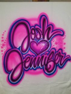 a white t - shirt with pink and purple graffiti writing on it that says, i love denver