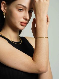 Enhance your bracelet collection with this striking 18K gold-plated layered chain bracelet, featuring rows of meticulously textured beads that offer a luxurious feel. A versatile addition for an effortlessly chic stacked look. Timeless Tarnish Resistant Gold Plated Bracelets, Timeless Tarnish Resistant Gold Plated Bracelet, Dainty Gold-plated Pearl Chain Bracelet, Yellow Gold Plated Bracelets With Pearl Chain, Everyday Luxury Gold-plated Tarnish Resistant Bracelets, Gold Multi-strand Beaded Bracelets For Layering, Gold Plated Minimalist Chain Bracelet, Gold Plated Tarnish Resistant Bracelet For Everyday Luxury, Dainty Gold Beaded Bracelets For Layering