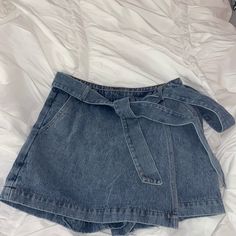 Brand New With Tags! Size Small, True To Size! Comfortable Denim Material! Has Pockets And Zips On The Side! Has A Wrap Around Belt That Can Be Tied Tighter! Shorts In The Back! Super Cute To Dress Up Or Down! It Is The Perfect Length, Not Too Short And I Am 5’3! Mid-rise Denim Shorts With Belt Loops, Light Wash Denim Shorts With Belt Loops, Blue Denim Jean Shorts With Belt Loops, Trendy Blue Jean Shorts With Belt Loops, Medium Wash Shorts With Pockets For Day Out, Denim High-waisted Shorts For Day Out, Dark Wash High-waisted Shorts For Day Out, Blue Denim Shorts With Belt Loops, Jean Shorts With Belt Loops For Day Out