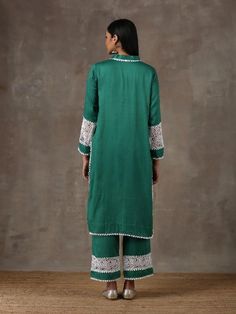 A two piece kurta set comprises of a soft cotton emerald green kurta with crochet fabric details insert on the sleeves along with delicate laces around the body. It is paired with matching culottes with crochet fabric details and lace detailing on the edges. Color: Emerald Green Fabric Composition: Kurta Set - Soft cotton Note: The product will be delivered within 20-25 days of order placed Care Instruction: Dry Clean Only. Do not use heavy Iron Emerald Green Fabric, Emerald Green Lace, Cotton Kurta Set, Crochet Fabric, Cotton Kurta, Kurta Set, Green Lace, Fabric Details, Best Deal