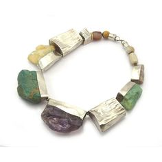 95% Pure Silver Beads With Agate Finishing Beads On The End Necklace 1 Approx. 19" long Inset : Citrine (46mm x 48mm), Amazonite (64mm x 48mm, 44mm x 30mm), Amethyst (65mm x 47mm) and Sable Moonstone (36mm x 20mm) Nugget Forms Hand finished and etched hammered 95% Thai Pure Silver Handcrafted in Northern Thailand Luxury Agate Beaded Necklace With Stones, Luxury Multicolor Agate Beads, Luxury Agate Jewelry With Gemstone Beads, Luxury Agate Jewelry With Faceted Beads, Luxury Spacer Beads Jewelry, Luxury Polished Agate Beads, Luxury Bohemian Agate Beads, Northern Thailand, Ethnic Jewelry