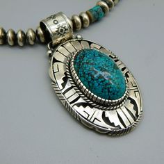 Handcrafted by Eli Gofman Sterling Silver Kingman and Hubei Turquoise Southwestern Artisan Necklace. - Etsy Bohemian Oval Turquoise Necklace Stamped 925, Artisan Turquoise Necklace With Sterling Silver Clasp, Artisan Turquoise Etched Jewelry, Southwestern Silver Oval Turquoise Necklace, Artisan Oval Turquoise Necklace Collectible, Artisan Etched Turquoise Jewelry, Handmade Southwestern Turquoise Necklace With Oval Pendant, Southwestern Oval Turquoise Necklace With Natural Stones, Handmade Southwestern Oval Turquoise Necklace