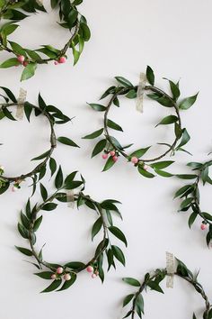 several wreaths made out of branches with flowers on them