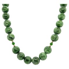 10mm Variegated Chrome Diopside Beaded Necklace with Yellow Gold Accents | From a unique collection of vintage Beaded Necklaces at https://www.1stdibs.com/jewelry/necklaces/beaded-necklaces/. Luxury Green Beaded Necklaces For Celebration, Cheap Green Beaded Pendant Necklace, Luxury Antique Gemstone Beaded Necklaces, Luxury Green Agate Beaded Necklaces, Luxury Antique Beaded Necklace With Polished Beads, Luxury Green Multi-stone Beaded Necklace, Cheap Vintage Beaded Necklaces With Polished Beads, South African Necklace Green, Strand Of Pearls