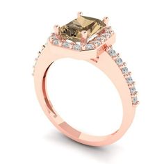 a rose gold ring with a square cut diamond surrounded by small white and brown diamonds