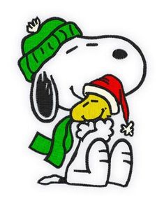 a snoopy with a christmas hat and scarf