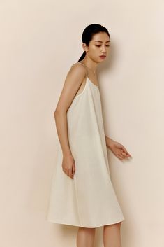 New from our 2022 Spring & Summer Collection, the Silk Cotton Slip Pajama Dress blends elegance and comfort for every evening this summer with a combination of fine silk and skin-friendly cotton — absolutely breathable and effortless to wear, with exquisitely refined design and details that allow you to move to your own rhythm and free your mind. Details Materials & Care Shipping & Returns • Designed in a subtle A-shape: a natural fit with a feminine touch. • Perfectly blends crisp, breathable c Unlined A-line Linen Dress For Daywear, Summer Sleep Maxi Dress, Beige Summer Slip Dress For Sleep, Elegant Relaxed Fit Dress For Loungewear, Beige Slip Dress For Summer Sleep, Summer Cotton Midi Dress For Loungewear, Sleeveless Relaxed Fit Midi Dress For Loungewear, Sleeveless Midi Dress With Relaxed Fit For Loungewear, Unlined A-line Midi Dress For Daywear