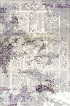 an area rug with many different colors and patterns on the carpet, including purples