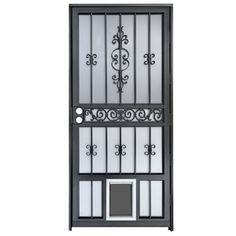 an iron door with glass panels and wrought designs on the sides, against a white background