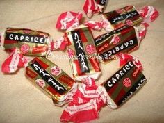 candy wrapped in red and white paper with the word capricci written on it